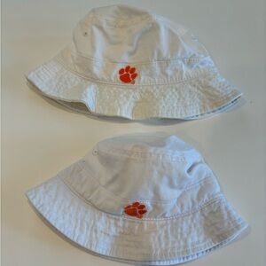 Never worn Clemson bucket hats, one baby, one toddler.